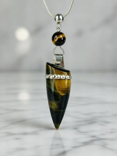 Tigrisszem ezüst medál